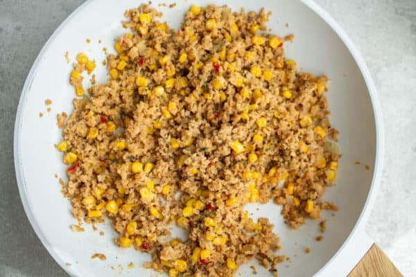 Soy grits, corn and spices in a pan